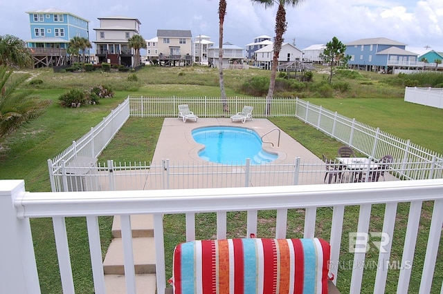 view of pool featuring a patio area and a lawn