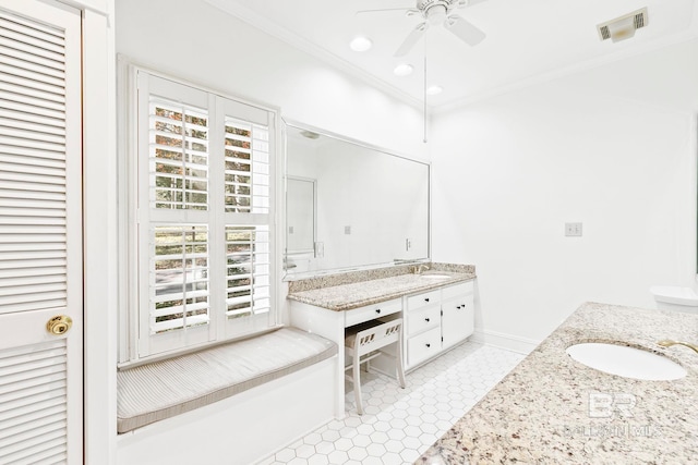 bathroom featuring ornamental molding, vanity, tile patterned floors, and a healthy amount of sunlight