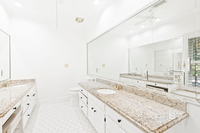 bathroom with tile patterned floors, vanity, toilet, and ceiling fan