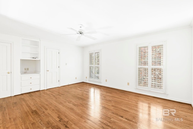 unfurnished bedroom featuring ceiling fan, light hardwood / wood-style floors, and ornamental molding