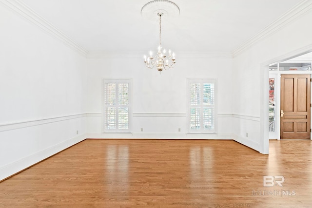 interior space with ornamental molding, light hardwood / wood-style floors, and a notable chandelier