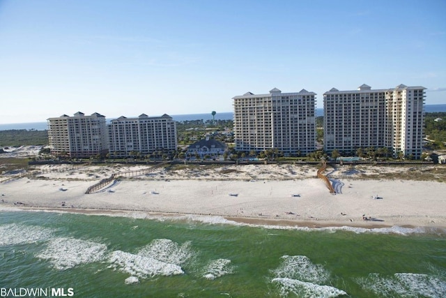 bird's eye view featuring a water view and a view of the beach