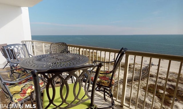 balcony with a beach view and a water view