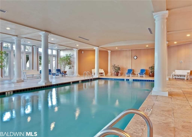 view of swimming pool featuring decorative columns