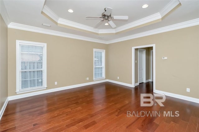 spare room featuring ornamental molding, ceiling fan, and dark hardwood / wood-style floors