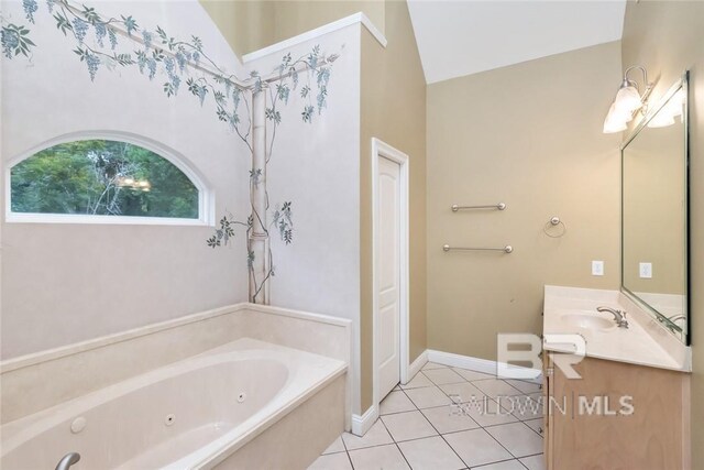 bathroom with lofted ceiling, vanity, a bathtub, and tile patterned flooring