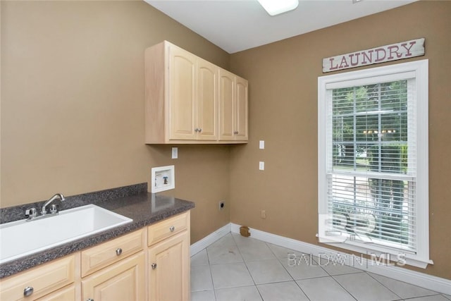 clothes washing area with hookup for a washing machine, light tile patterned floors, hookup for an electric dryer, sink, and cabinets