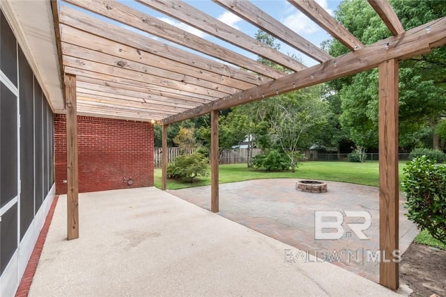 view of patio / terrace with a fire pit and a pergola