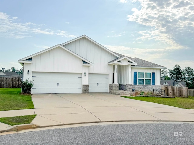 view of front of house featuring a front yard and a garage