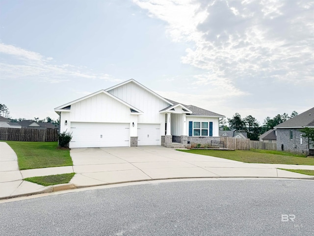 view of front of house with a front lawn and a garage