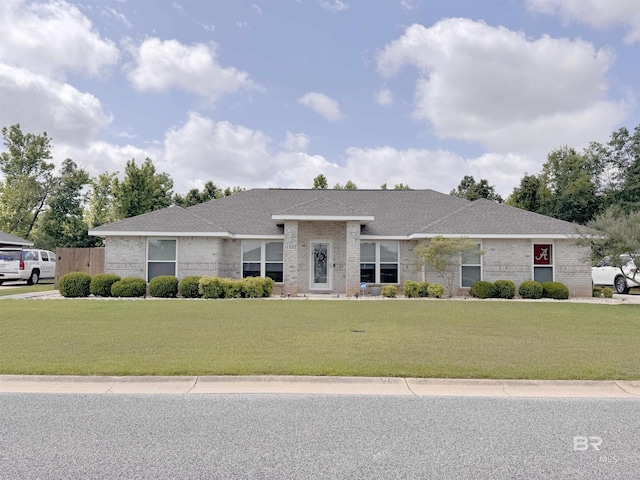 1052 Orlando Dr, Foley, AL 36535 - view of front facade featuring brick siding, a front lawn, and a shingled roof