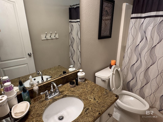 1052 Orlando Dr, Foley, AL 36535 - full bath with toilet, vanity, and a shower with shower curtain