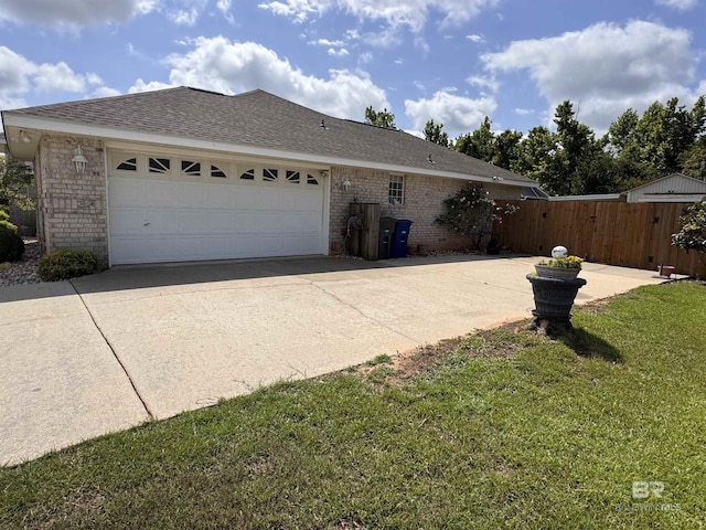 1052 Orlando Dr, Foley, AL 36535 - view of property exterior featuring brick siding, concrete driveway, an attached garage, roof with shingles, and a gate