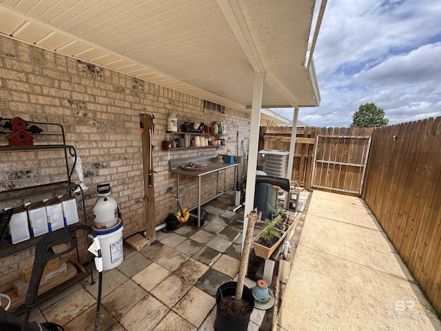 1052 Orlando Dr, Foley, AL 36535 - view of patio / terrace with central AC unit