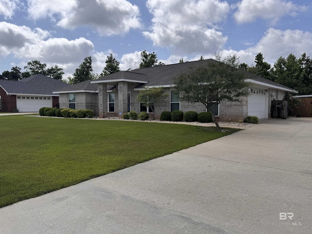 1052 Orlando Dr, Foley, AL 36535 - view of front of home with an attached garage, driveway, brick siding, and a front lawn