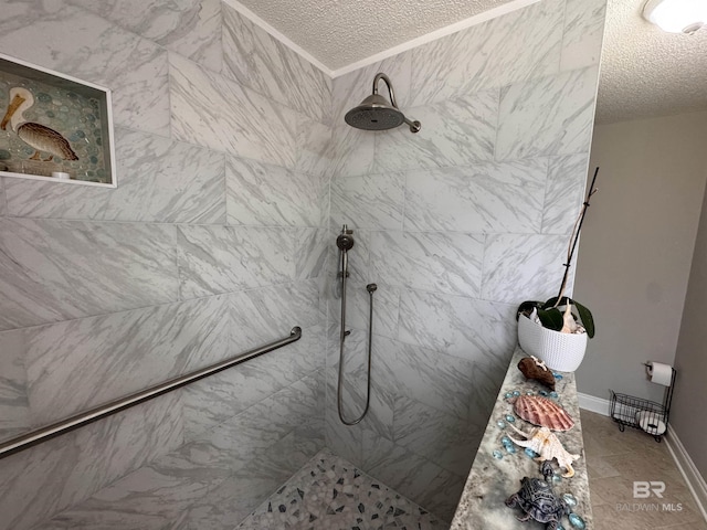 1052 Orlando Dr, Foley, AL 36535 - bathroom featuring a textured ceiling, a tile shower, and ornamental molding