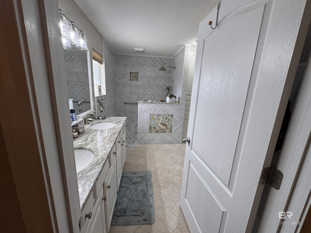 1052 Orlando Dr, Foley, AL 36535 - full bathroom featuring walk in shower, a textured ceiling, double vanity, and tile patterned floors