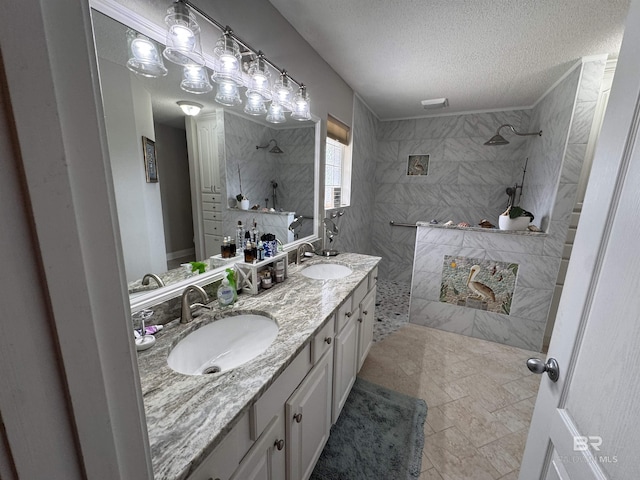 1052 Orlando Dr, Foley, AL 36535 - full bathroom with walk in shower, a textured ceiling, and double vanity