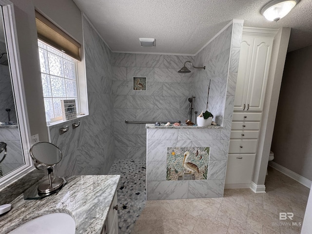 1052 Orlando Dr, Foley, AL 36535 - full bath with a textured ceiling, walk in shower, toilet, vanity, and ornamental molding