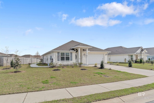 single story home featuring a garage and a front lawn