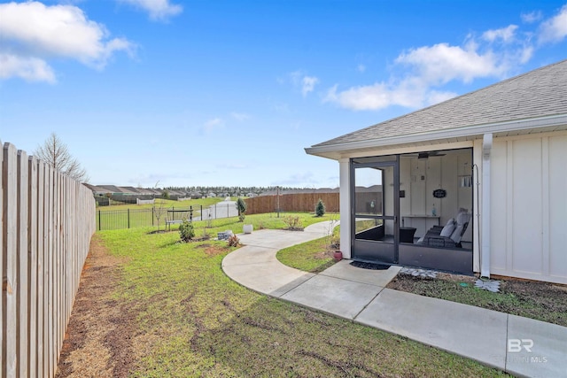 view of yard featuring a sunroom