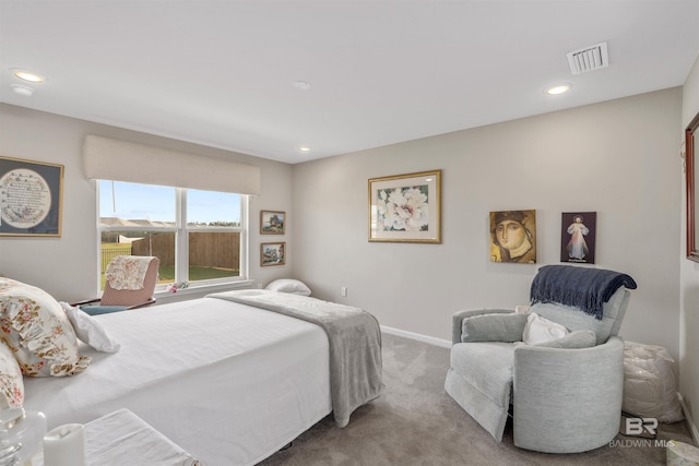 bedroom with light colored carpet