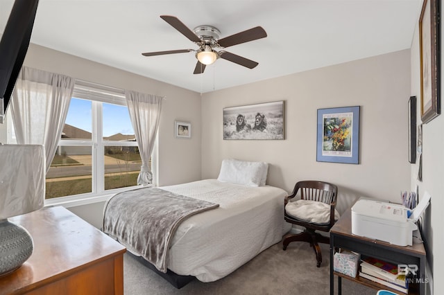 carpeted bedroom with ceiling fan