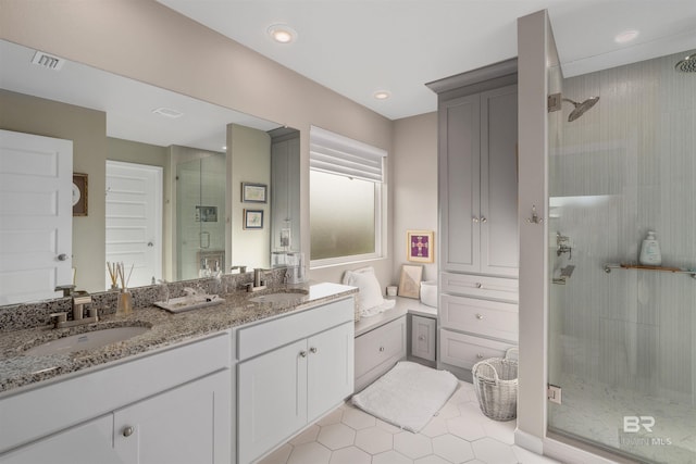 bathroom with vanity and an enclosed shower