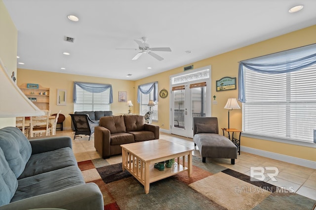 6065 Sawgrass Dr, Gulf Shores, AL 36542 - living area with recessed lighting, light tile patterned flooring, plenty of natural light, and visible vents