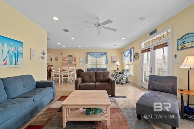 6065 Sawgrass Dr, Gulf Shores, AL 36542 - living area featuring french doors, light tile patterned floors, recessed lighting, visible vents, and baseboards