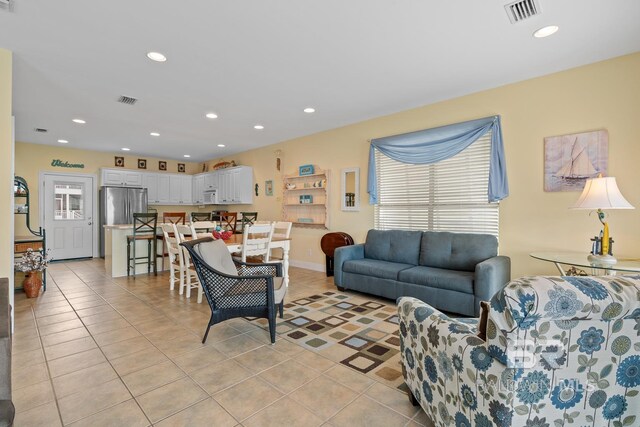 6065 Sawgrass Dr, Gulf Shores, AL 36542 - living room with light tile patterned floors, visible vents, and recessed lighting