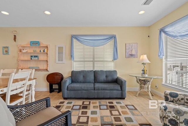 6065 Sawgrass Dr, Gulf Shores, AL 36542 - living area featuring light tile patterned floors, baseboards, and recessed lighting