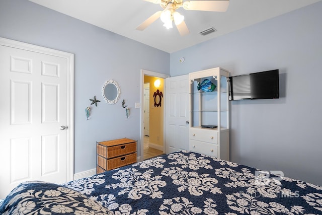 6065 Sawgrass Dr, Gulf Shores, AL 36542 - bedroom with ceiling fan, tile patterned floors, visible vents, and baseboards