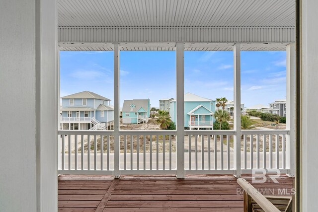 6065 Sawgrass Dr, Gulf Shores, AL 36542 - unfurnished sunroom with a residential view