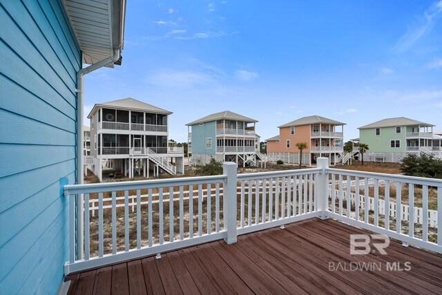6065 Sawgrass Dr, Gulf Shores, AL 36542 - deck featuring a residential view and a sunroom