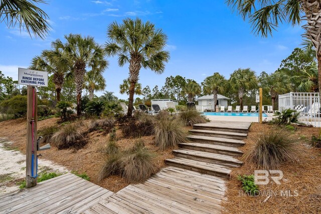 6065 Sawgrass Dr, Gulf Shores, AL 36542 - deck featuring a community pool