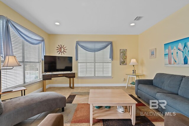 6065 Sawgrass Dr, Gulf Shores, AL 36542 - living area featuring recessed lighting, visible vents, baseboards, and light tile patterned flooring