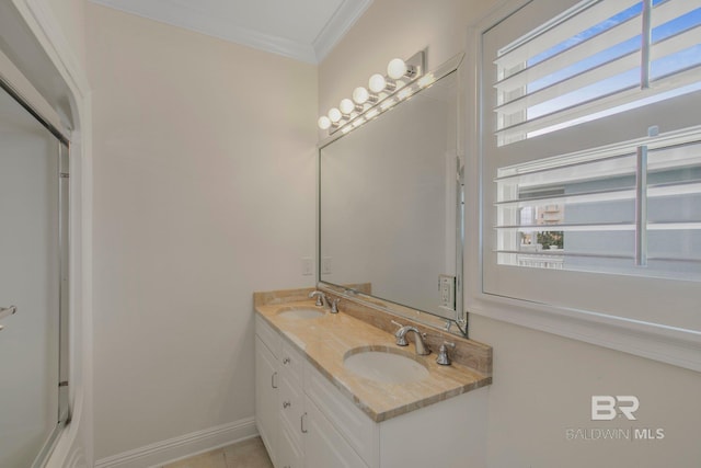 bathroom featuring tile patterned flooring, vanity, and ornamental molding