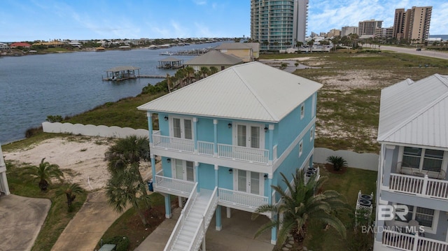 birds eye view of property with a water view