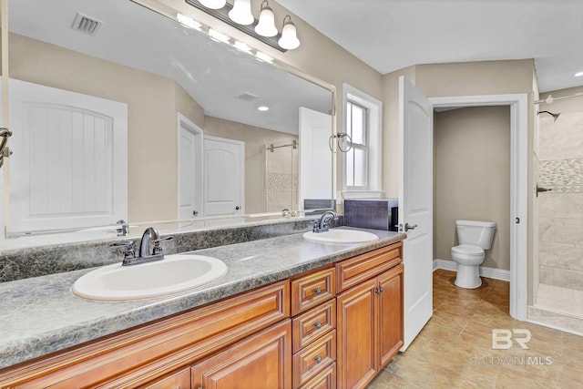 28165 Turkey Branch Dr, Daphne, AL 36526 - bathroom featuring tiled shower, double vanity, toilet, and tile patterned flooring