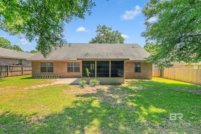 28165 Turkey Branch Dr, Daphne, AL 36526 - rear view of house with a sunroom, brick siding, and a patio area