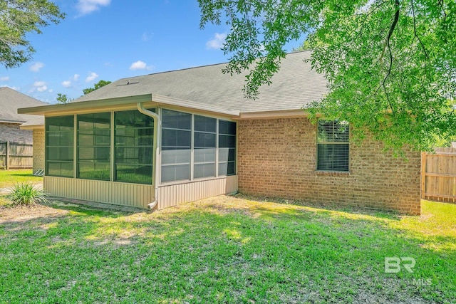 28165 Turkey Branch Dr, Daphne, AL 36526 - back of house with a sunroom, roof with shingles, and brick siding