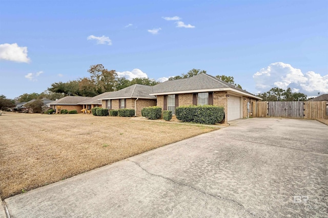 view of front of house featuring a garage and a front yard