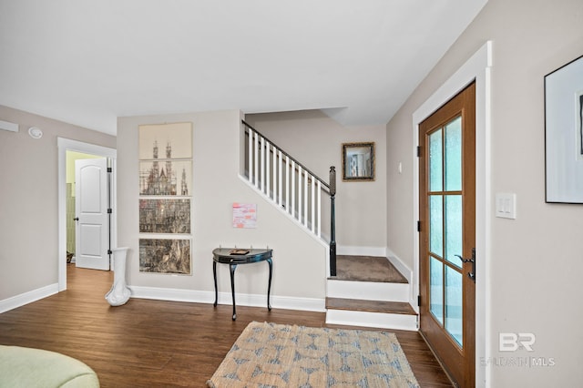 entrance foyer with dark hardwood / wood-style floors