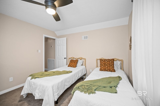 bedroom with vaulted ceiling, ceiling fan, and carpet flooring
