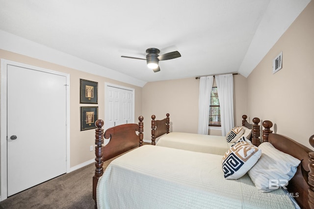 bedroom featuring lofted ceiling, carpet floors, ceiling fan, and a closet