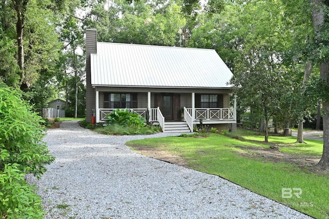view of front of house featuring a front yard and covered porch