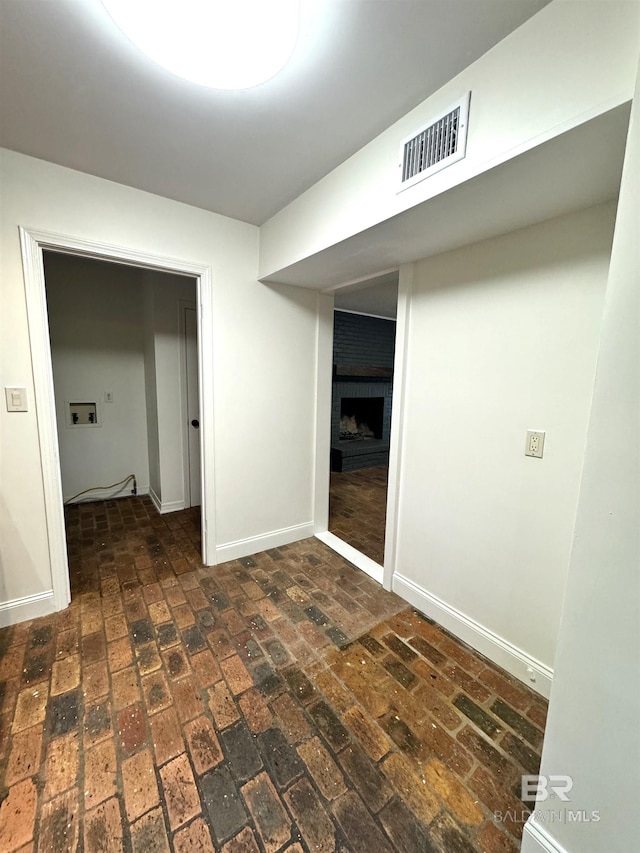 interior space featuring a brick fireplace