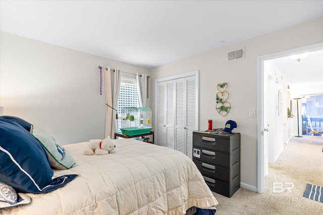 carpeted bedroom featuring a closet