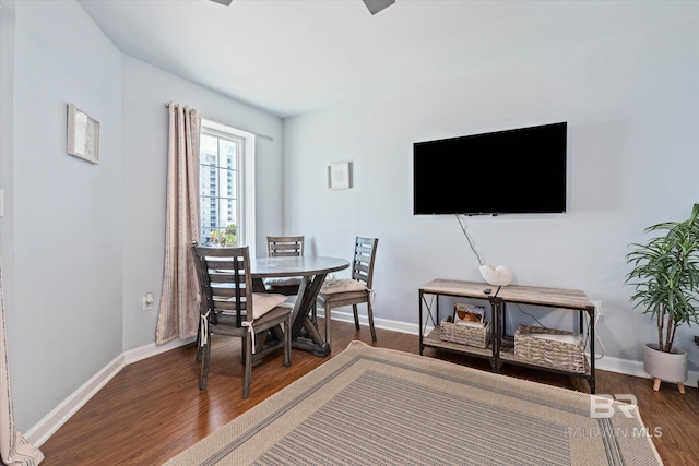 dining room with dark wood-style floors and baseboards